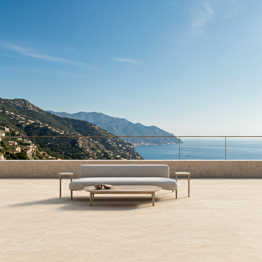 A high-angle shot of a minimalist villa terrace in Sierra Blanca overlooking the mountains and sea in a warm champagne tone.
